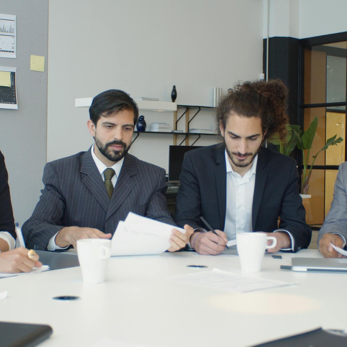 Team of attorneys reviewing Defective Medical Device Lawsuits documents at a conference table