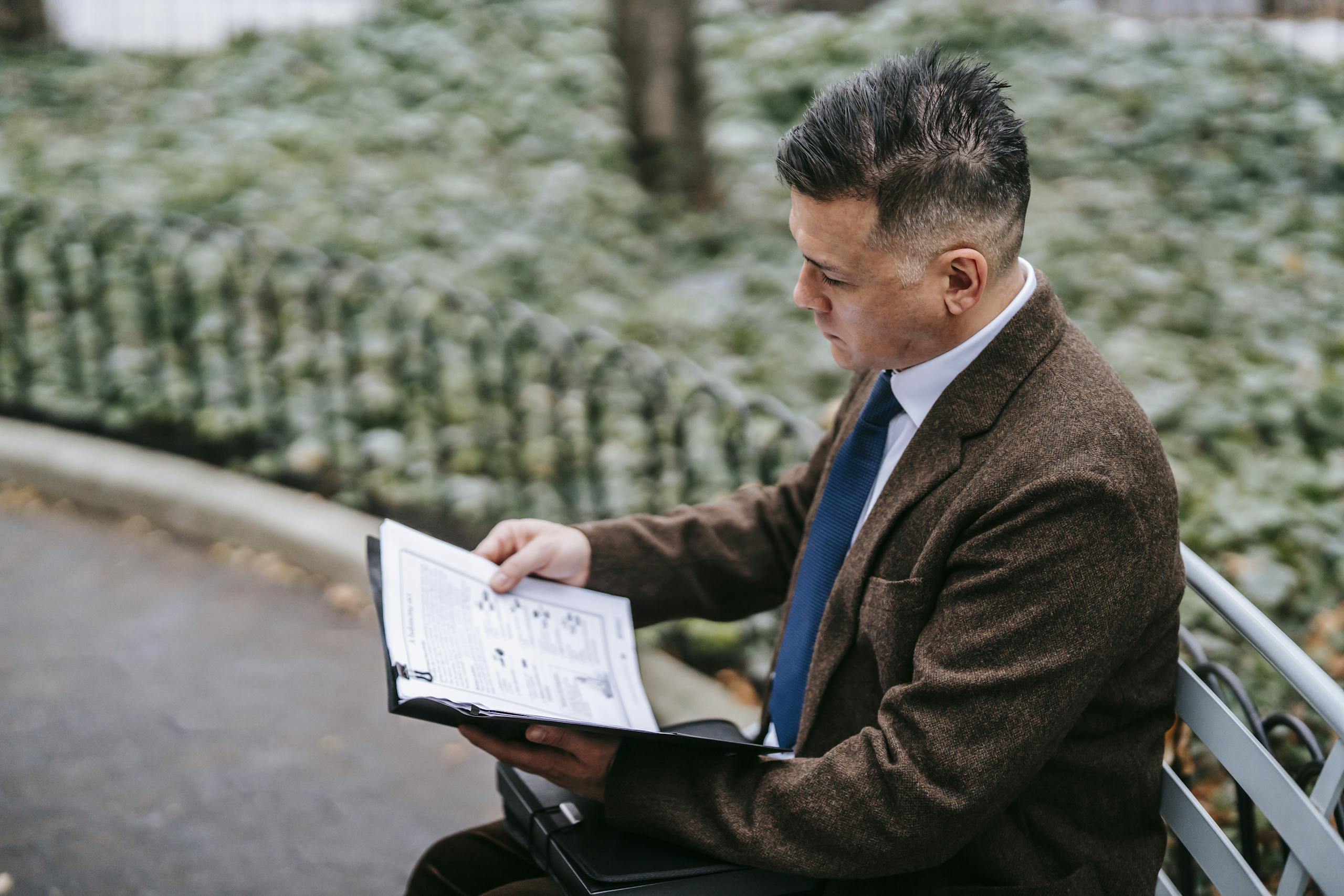 Concerned man reviewing legal documents with Texas Legal Malpractice Lawyers after experiencing attorney negligence in Texas