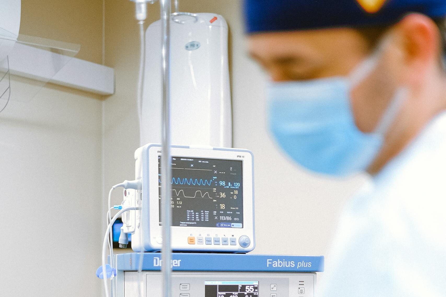 Surgeon in operating room with medical monitor - hernia mesh lawsuit implant procedure